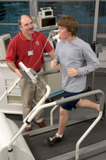 Young man jogging on a treadmill